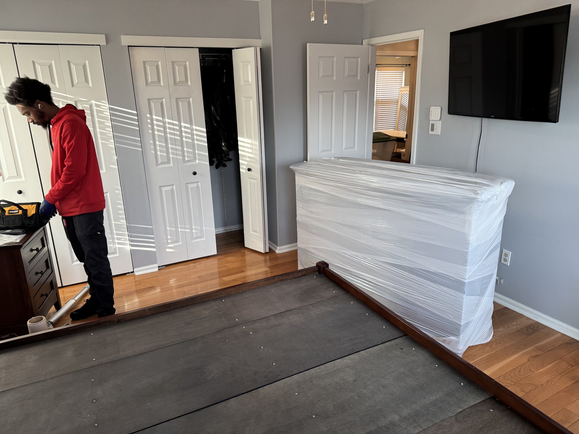 Experienced Bellmawr moving team providing professional residential moving services with complete home protection Bellmawr NJ moving crew completing residential relocation with full wrapping padding and careful furniture handling by local movers
